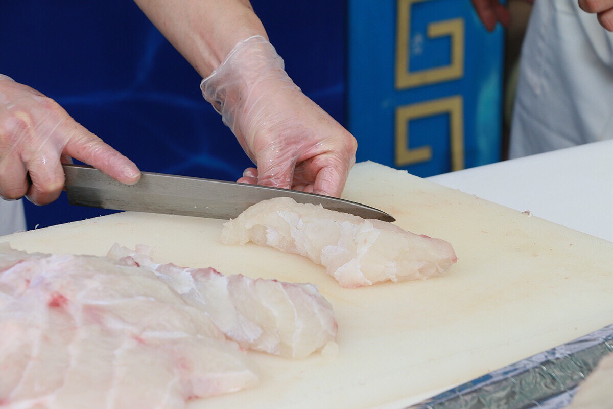 The Chef slices sashimi from Phu Quy giant grouper